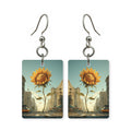 Avenue sunflower earrings — sunflowers lining a road, cut-paper landscape, made in USA