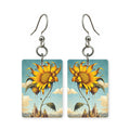 Skyline sunflower earrings — sunflowers against a city skyline, cut-paper art, made in USA