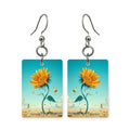 Desert bloom earrings — desert flowers against dry ground, cut-paper art, made in USA