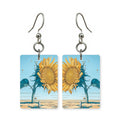 Whimsy sunflower earrings — loose playful sunflower design in cut paper, made in USA