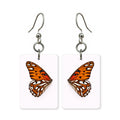 Orange fritillary earrings — orange checkered butterfly wing, cut-paper art, made in USA
