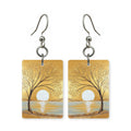 Moonlit tree earrings — lone tree under a full moon, cut-paper landscape, made in USA