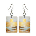Amber sunset earrings — sunset through amber haze in cut-paper landscape, made in USA