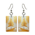 Amber pathway earrings — path through amber autumn trees, cut-paper landscape, made in USA