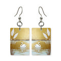 Golden swan earrings — swan on gold water in cut-paper art, made in USA