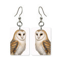 Barn owl earrings — heart-faced barn owl with dark eyes in cut paper, made in USA