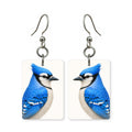 Blue jay earrings — crested blue jay with barred wings in cut-paper portrait, made in USA