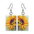 Vibrant sunflower earrings — sunflowers in bold saturated color, cut-paper art, made in USA