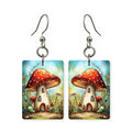Mushroom cottage earrings — fairy cottage built into a mushroom cap, cut-paper art, made in USA