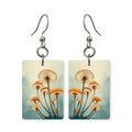 Mushroom grove earrings — mushrooms on the forest floor, cut-paper art, made in USA