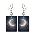Crescent wreath earrings — crescent moon wrapped in a floral wreath, cut-paper art, made in USA