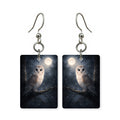Moonlit owl earrings — owl on a branch under a full moon, cut-paper art, made in USA