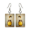 Honey dipper jar earrings — wooden dipper resting in a full honey jar, made in USA