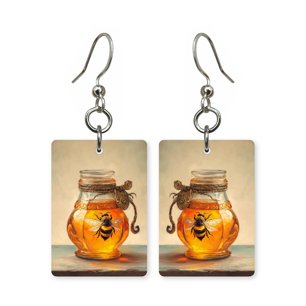 Bee in amber earrings — honey bee suspended in warm amber gold, cut-paper art, made in USA