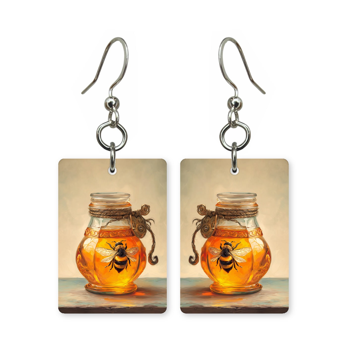 Bee in amber earrings — honey bee suspended in warm amber gold, cut-paper art, made in USA