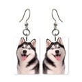 Blue-eyed husky earrings — Siberian husky with pale blue eyes, cut-paper portrait, made in USA