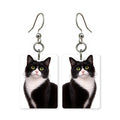 Tuxedo cat earrings — black and white tuxedo cat portrait in cut paper, made in USA