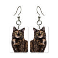Tortoiseshell cat earrings — patchwork black and orange tortie cat portrait, made in USA