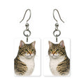 Golden tabby earrings — warm striped tabby cat with green eyes, cut-paper portrait