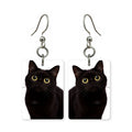 Black cat earrings — black cat silhouette with bright eyes, cut-paper portrait, made in USA