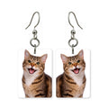 Smiling tabby cat earrings — striped tabby cat mid-smile in cut-paper portrait, made in USA