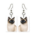 Siamese cat earrings — pointed cat with blue eyes in cut-paper portrait, made in USA