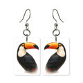 Toco toucan earrings — toucan with large orange bill, cut-paper portrait, made in USA