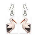 White stork earrings — white stork on long red legs, cut-paper portrait, made in USA