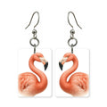 Pink flamingo earrings — flamingo standing on one leg, cut-paper portrait, made in USA