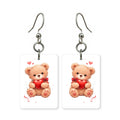 Heart teddy bear earrings — teddy bear holding a heart, cut-paper art, made in USA