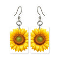 Yellow sunflower earrings — bright yellow sunflowers face on, cut-paper art, made in USA