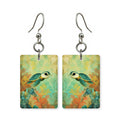 Golden reef turtle earrings — sea turtle over gold-lit reef, cut-paper art, made in USA