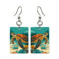 Ocean reef turtle earrings — sea turtle along the reef edge, cut-paper art, made in USA