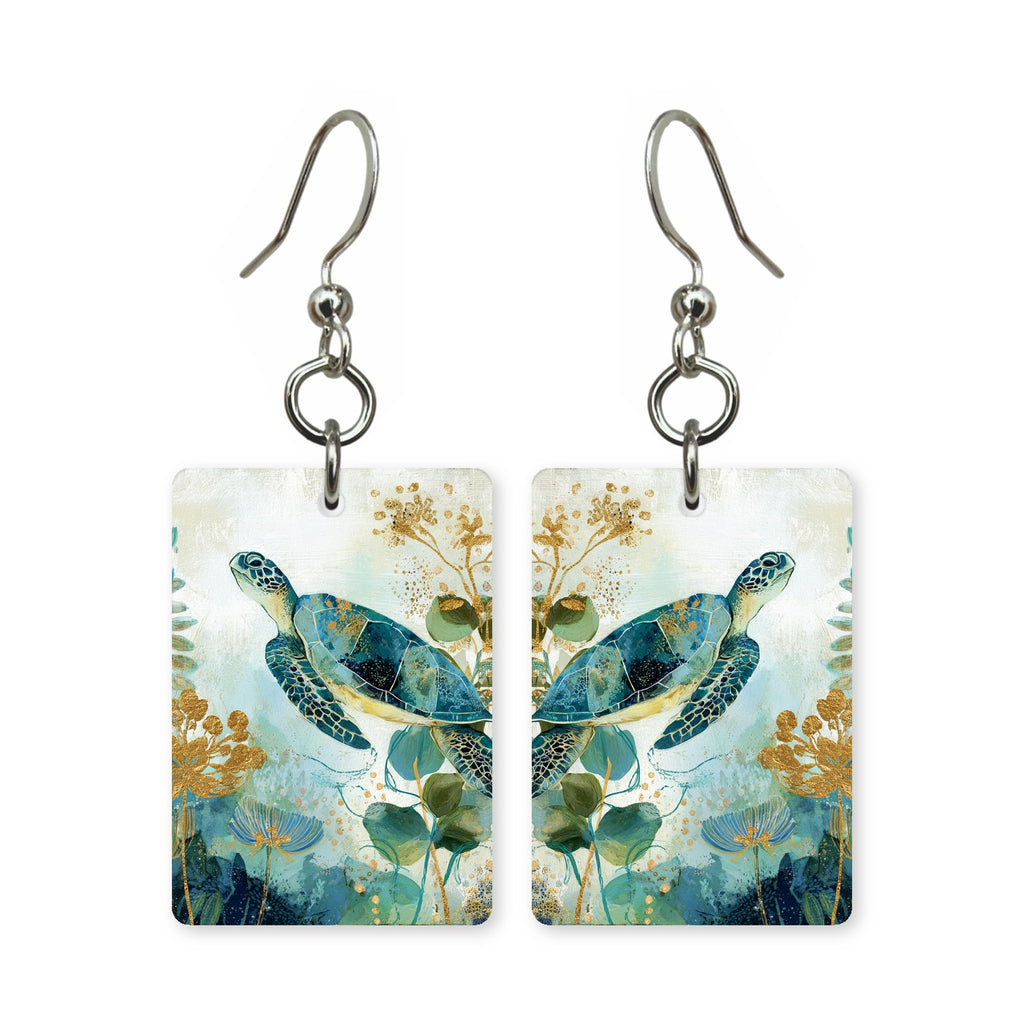 Golden sea turtle earrings — turtle lit gold through the water, cut-paper art, made in USA
