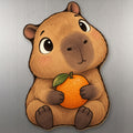 Orange Capybara wood magnet M274 on a stainless steel fridge, made in USA