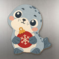 Snowy Seal wood magnet M341 on a stainless steel fridge, made in USA