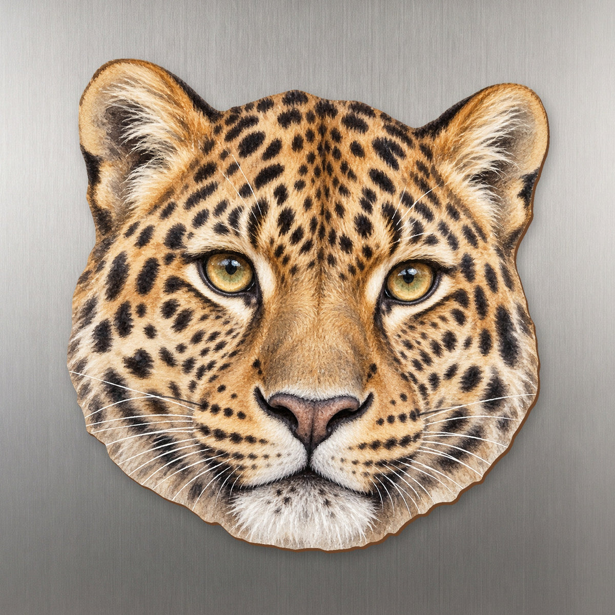Amur Leopard face wood magnet, shown on stainless steel.