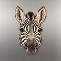 Plains Zebra face wood magnet, shown on stainless steel.