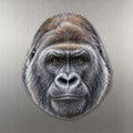 Gorilla face wood magnet, shown on stainless steel.
