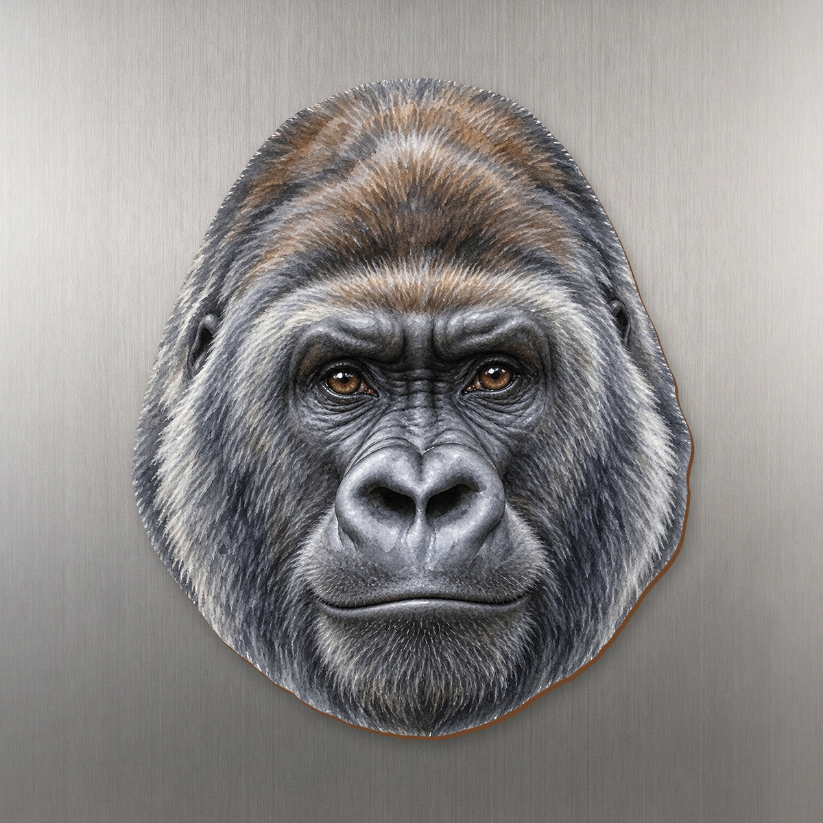 Gorilla face wood magnet, shown on stainless steel.