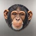 Chimpanzee face wood magnet, shown on stainless steel.