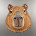 Capybara face wood magnet, shown on stainless steel.