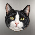 Tuxedo Cat face wood magnet, shown on stainless steel.