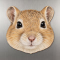 Gerbil face wood magnet, shown on stainless steel.
