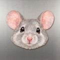 Fancy Mouse face wood magnet, shown on stainless steel.
