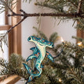 Laser-cut maple wood Hammerhead Shark folk art ornament O105 hanging on a fir branch, made in USA