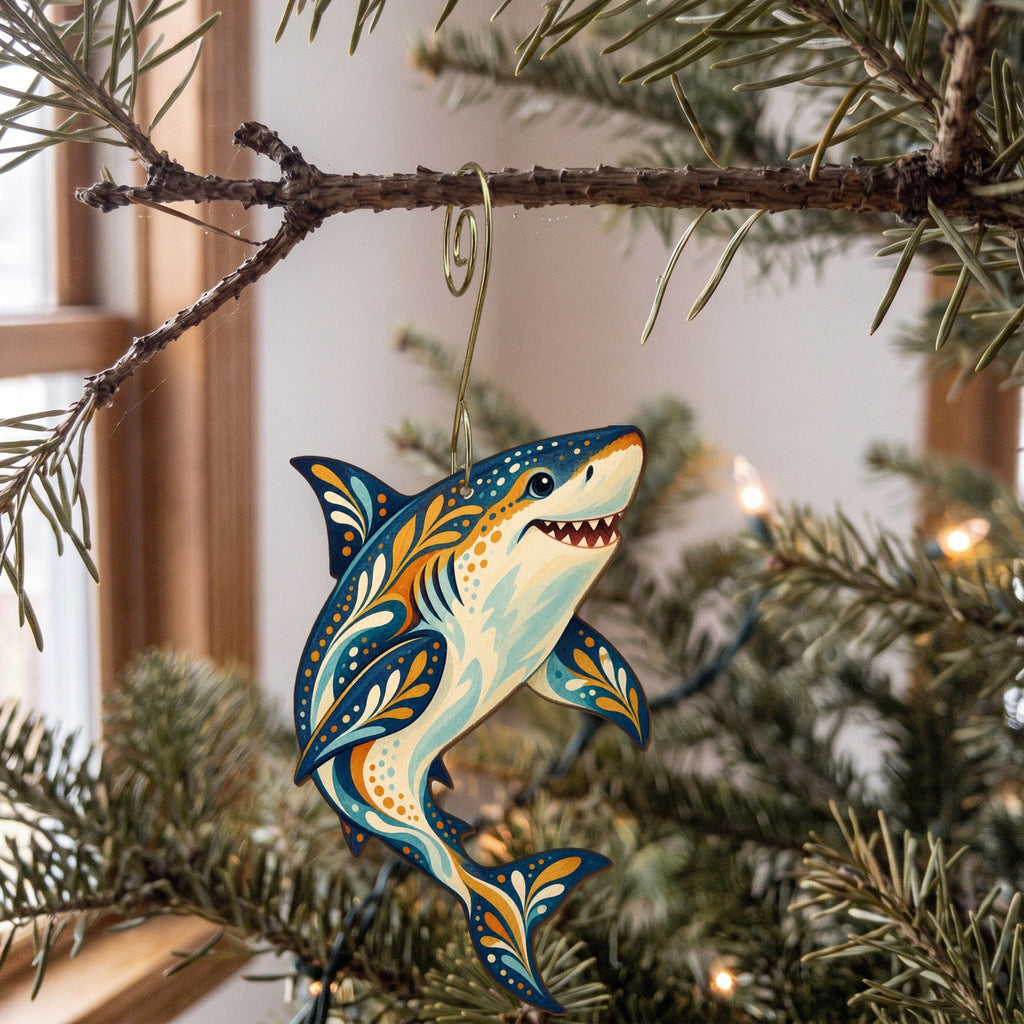 Laser-cut maple wood Great White Shark folk art ornament O106 hanging on a fir branch, made in USA