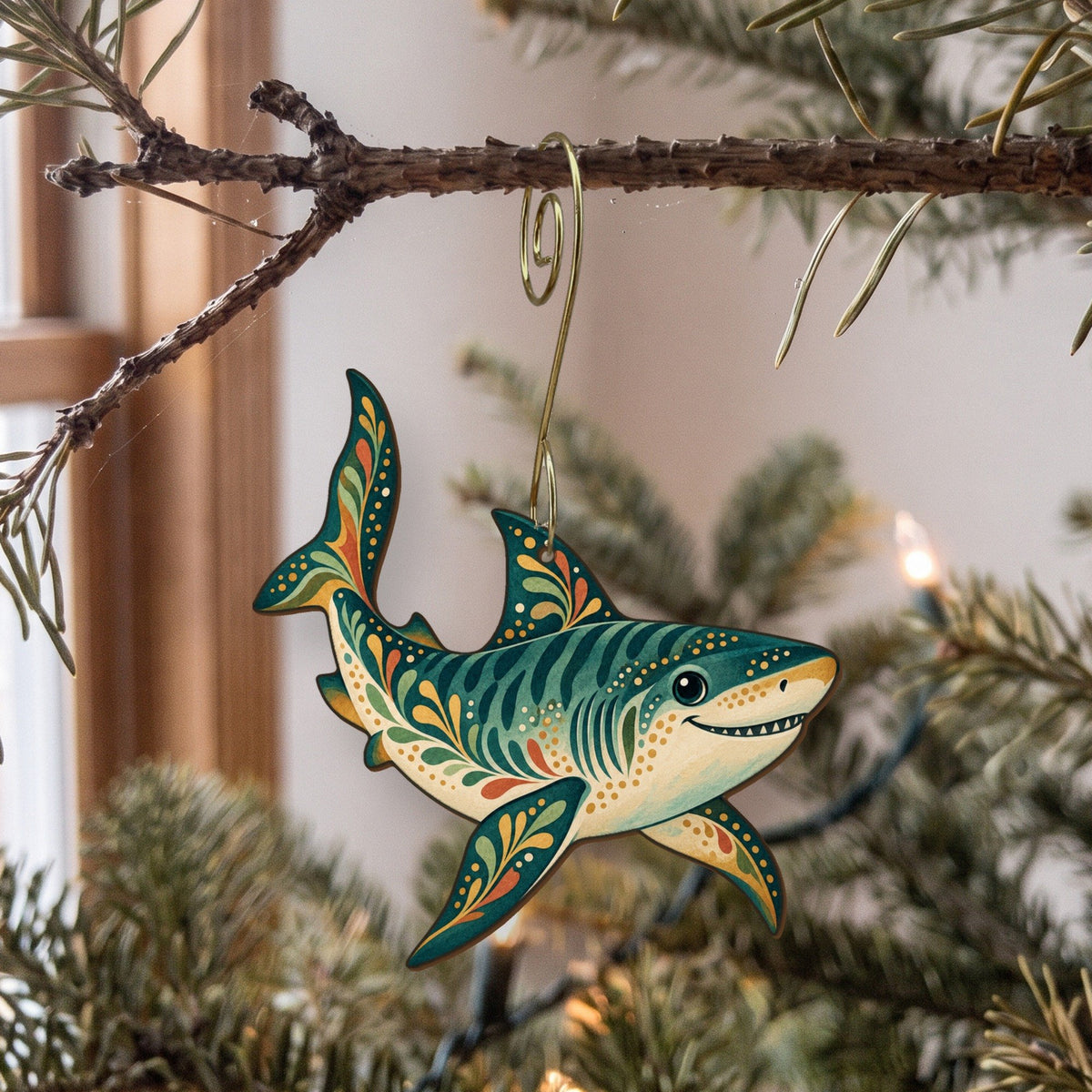 Laser-cut maple wood Tiger Shark folk art ornament O107 hanging on a fir branch, made in USA