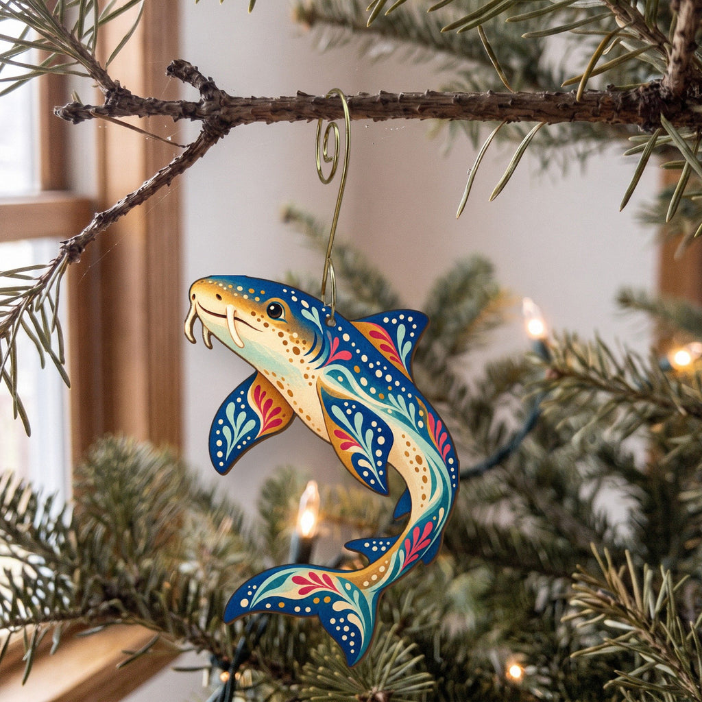 Laser-cut maple wood Nurse Shark folk art ornament O109 hanging on a fir branch, made in USA