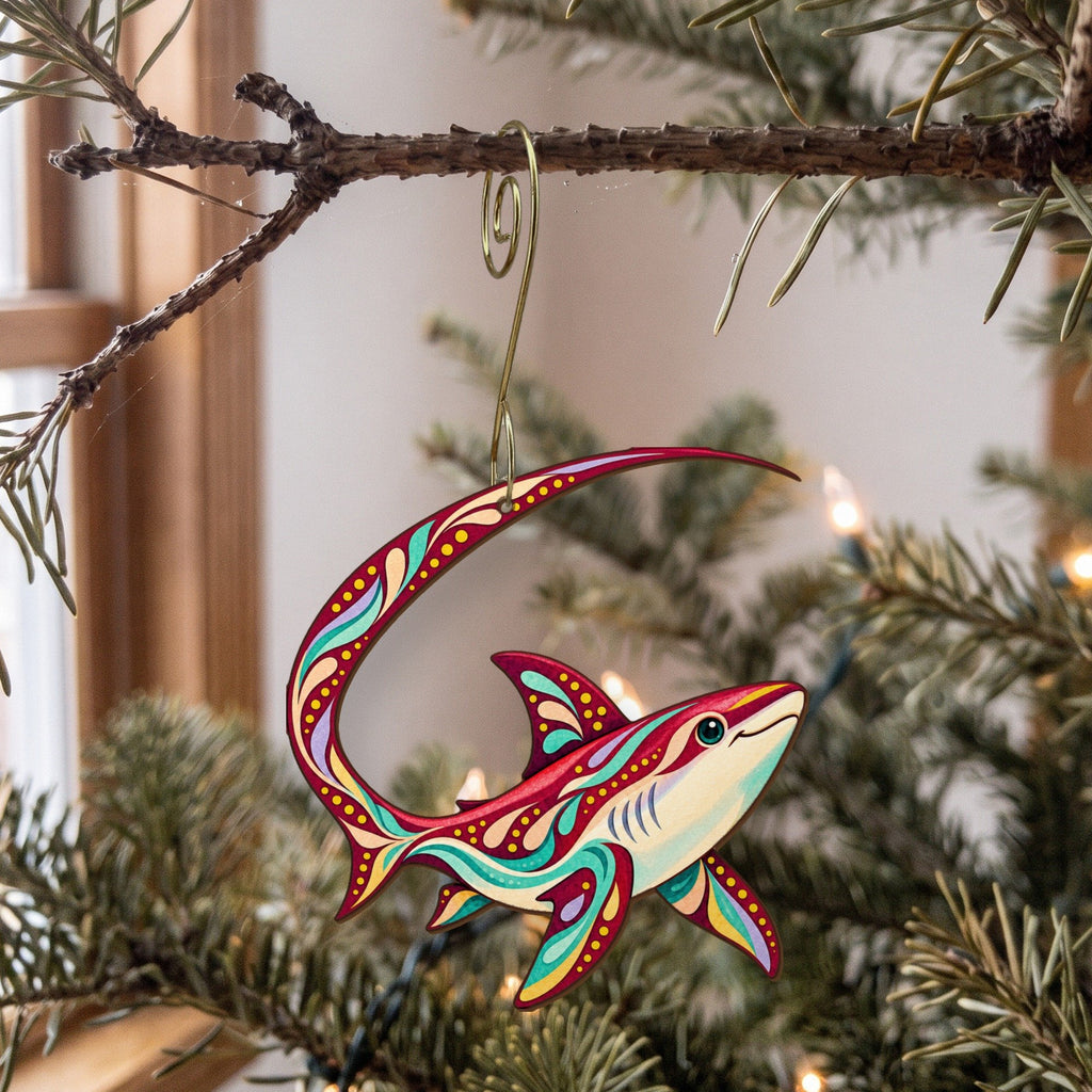 Laser-cut maple wood Thresher Shark folk art ornament O110 hanging on a fir branch, made in USA
